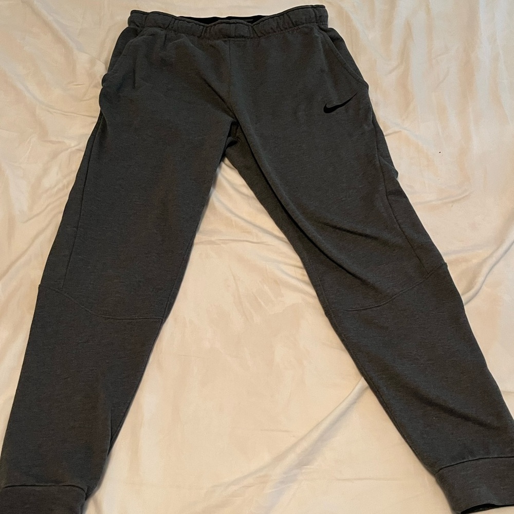 A pair of grey Nike dry fit sweatpants. Size medium. Good condition!
